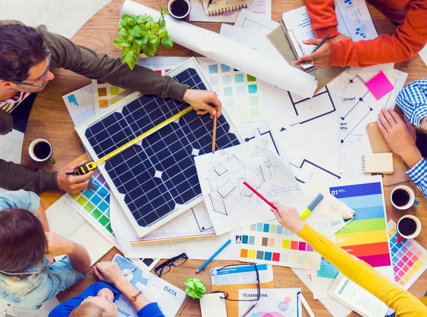 A group of people working on solar panels.