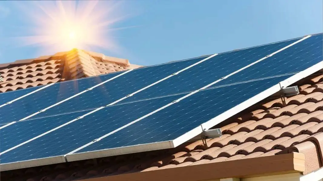 A solar panel on the side of a roof.