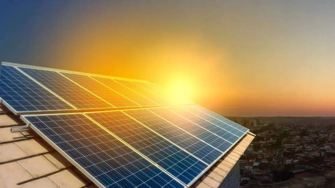 A close up of a solar panel on top of a building