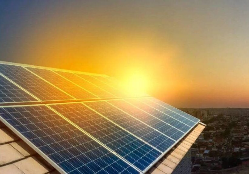 A close up of a solar panel on top of a building